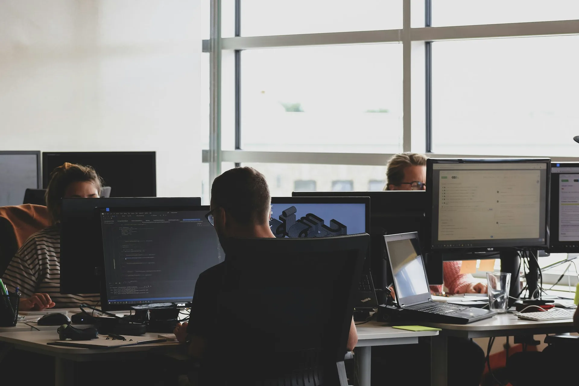A platform engineering team working at their desks