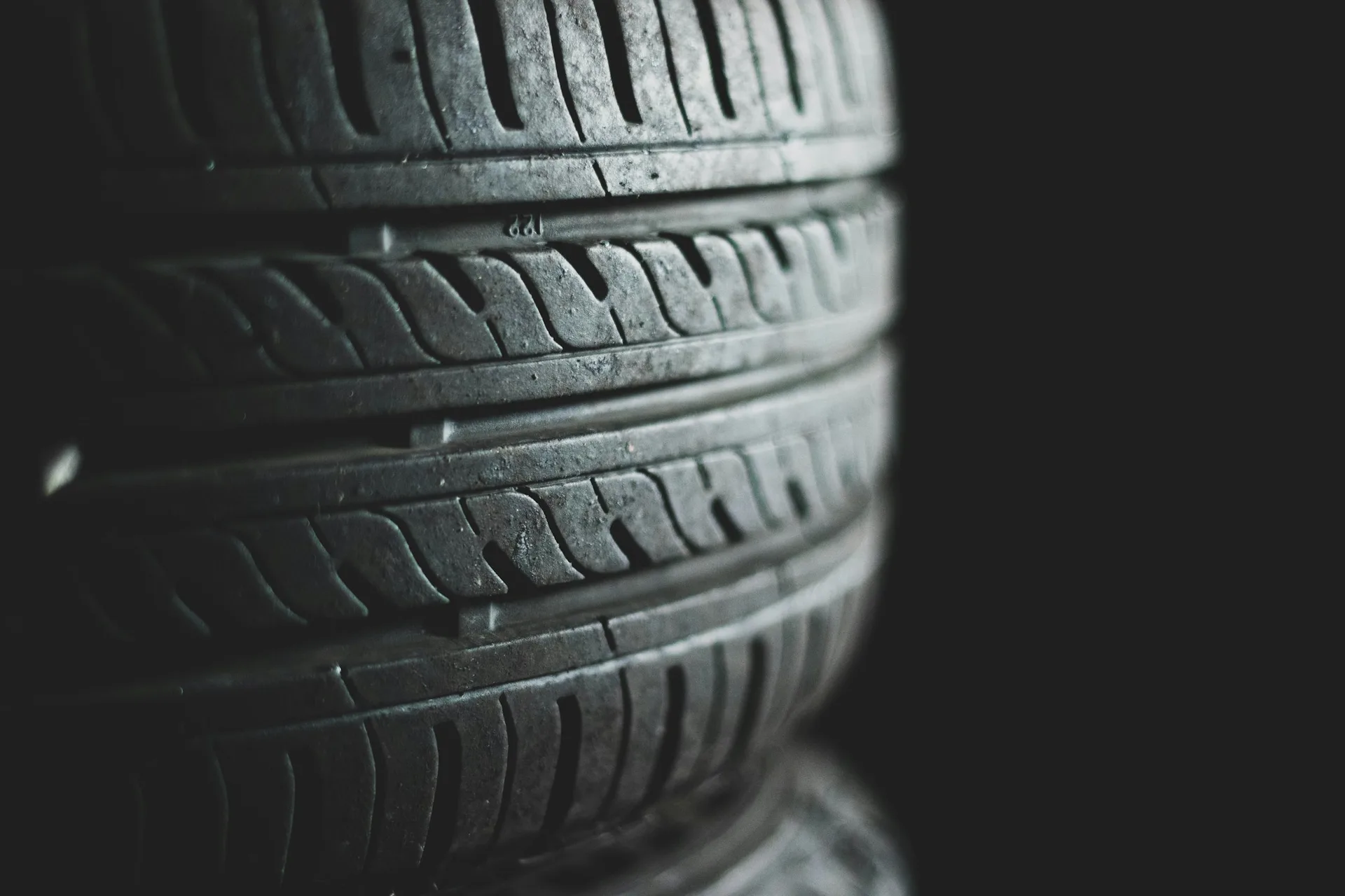 Rows of stacked tyres in a distribution warehouse